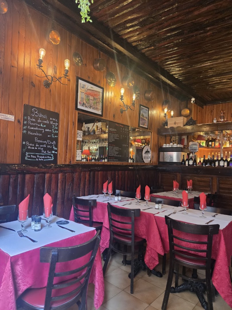 The warm wood dining room set with red napkins